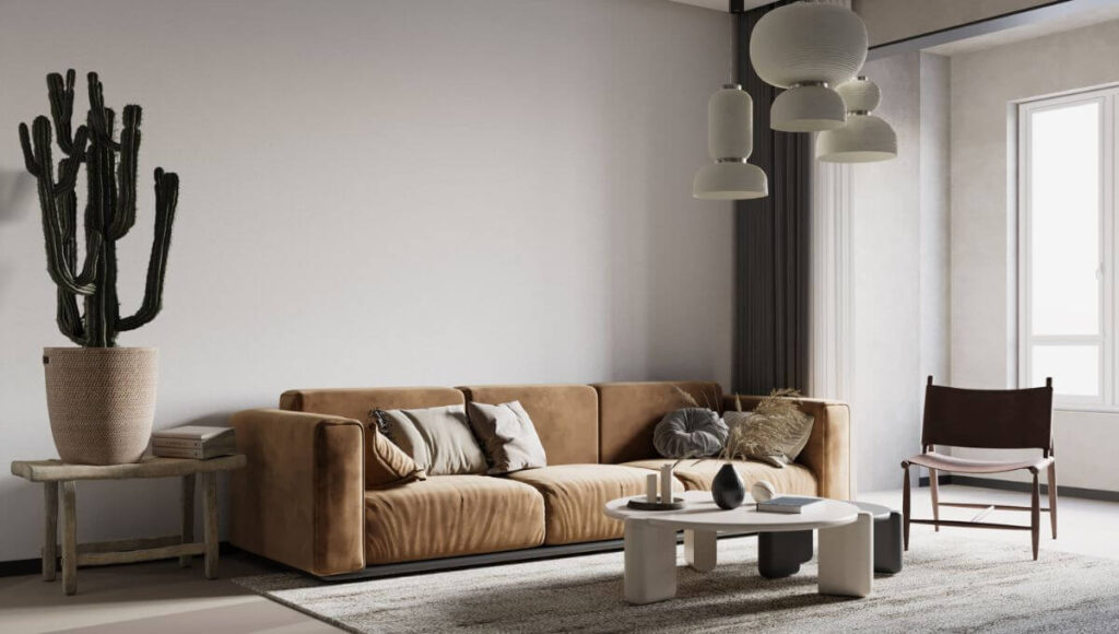 Na zdjęciu widać prostą zamszową sofę i wiszące papierowe lampy w salonie japandi.